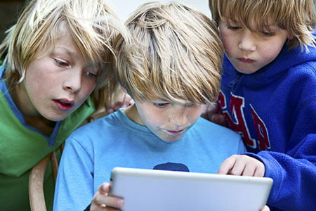 3 boys with iPad